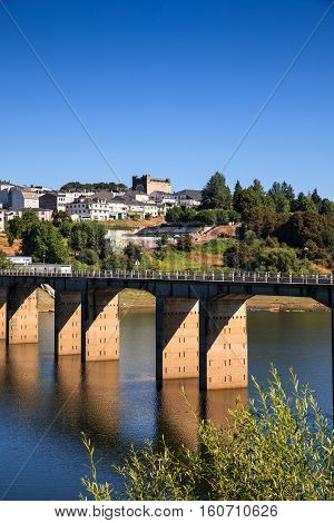 Roman bridge over the Minho River in Portomarin Spain