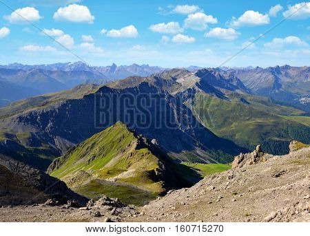 View from the mountain top Weissfluhjoch situated in the Plessur Range near Davos in canton Graubunden, Swiss alps.