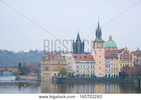 Panorama of an old Prague, bridges and embankment of Vitava river, Czechia