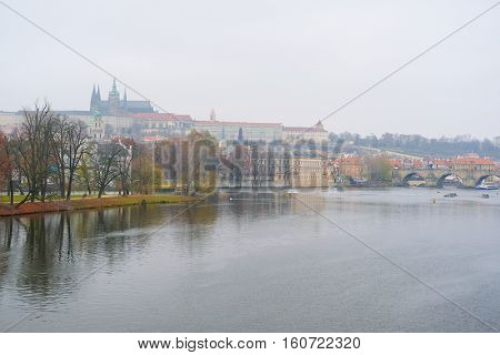 Panorama of an old Prague, bridges and embankment of Vitava river, Czechia