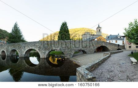 Viewe of the Roman bridge and Church of San Nicola da Bari in Molinaseca Spain