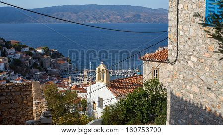 Top view on houses and yachts marina at Hydra island, Greece, Aegean sea.
