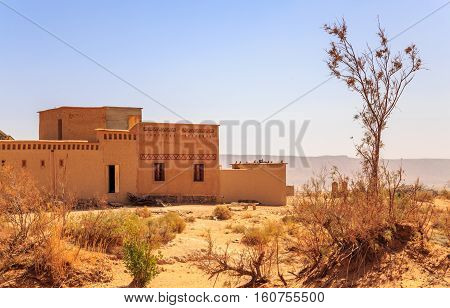 front view on typical moroccan kasbah in desert