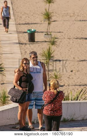 Tourists on the Beach
Mar del Plata, Buenos Aires, Argentina - November 25, 2014: Couple of tourists taking a photo on the beach. Classic summer scene on the coast of Argentina. Image taken in the seaside resort of Mar del Plata, Buenos Aires, Argentina.