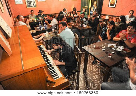 Salta Argentina - 21 February 2011 People listening at a music entertainment at the bar of La Casona on Salta Argentina