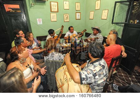 Salta Argentina - 21 February 2011 People listening at a music entertainment at the bar of La Casona on Salta Argentina