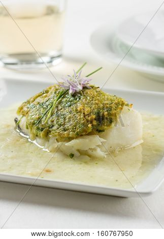 Bacalao fillet Basque style made with dried cod garlic green peppers onion and parsley.