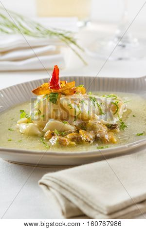 Cocochas (in basque kokotxas) refer to the flesh under a fish's jaw. Due to their high gelatinous content they make a fantastic broth. They are usually prepared with olive oil garlic and parsley.