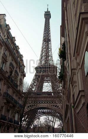 Unusual view to Eiffel tower. Early spring in Paris. The city of love and romance. Sightseing. City walk in Paris on foggy day early spring. Thoughts about future. perspective. tourism. calmness.