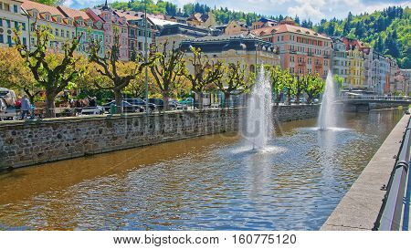 Fountain In Tepla River And Promenade In Karlovy Vary