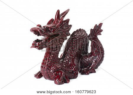 Brown traditional chinese dragon on white background. Feng Shui statuette.
