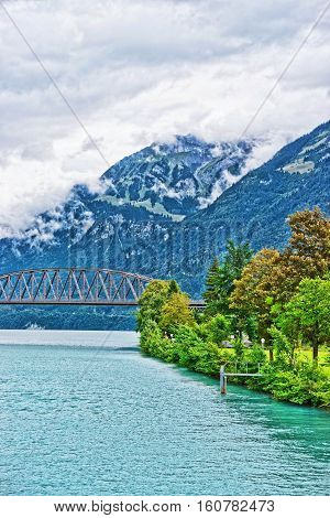 Bridge Over Lake Brienz And Brienzer Rothorn Mountain Bern Switzerland