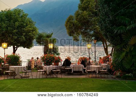 People Dining At Typical Sidewalk Restaurant In Ascona Switzerland