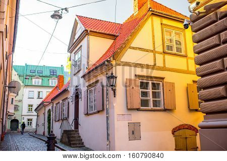 Ancient residential houses with window shutters in the old town of Riga