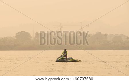 Lifeguard on jetski floating on river wait for rescue sporter in triathlonThailand.