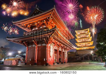 Colorful firework over abstract beautiful temple in japanese style celebrate new year at night time