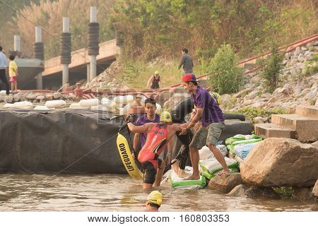 CHIANG RAITHAILAND-APR 32016 : Lifeguard and Triathlon athlete sporter in Golden Triangle Triathlon on April 3 2016 in Chiang sean district Chiang raiThailand.