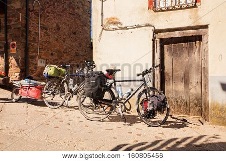 EL ACEBO DE SAN MIGUEL SPAIN - AUGUST 05: Bicycles of pilgrimn parked next to the door during the way of St. James on August 05 2016