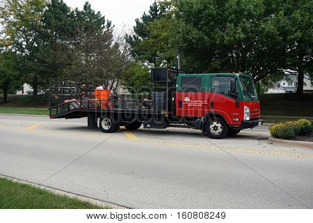 JOLIET, ILLINOIS / UNITED STATES - OCTOBER 5, 2016:  A truck belonging to Ground Pros Inc. is parked on the Wesmere Parkway in Joliet.