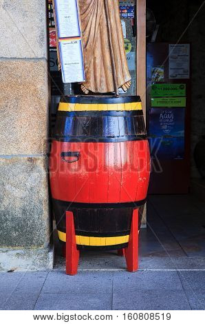 SARRIA SPAIN - AUGUST 11: Red barrel next to the entrance of a pub on August 11 2016