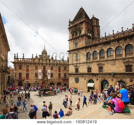 SANTIAGO SPAIN - AUGUST 16: Pilgrimns and tourists next to the Santiago cathedral on August 16 2016