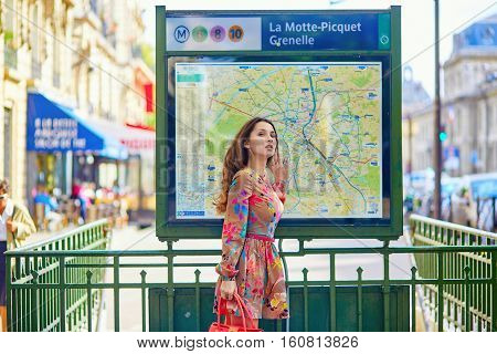 Young Parisian Woman Near The Subway Plan