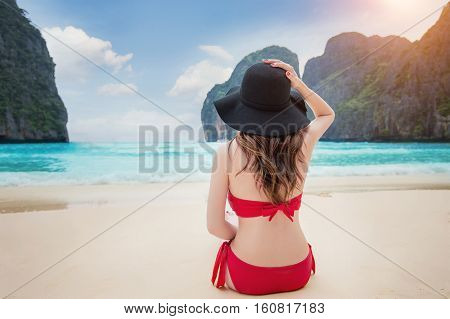 Beaitiful girl in red bikini at beach.