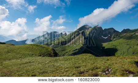 Clouds rushing past mountain peaks in Switzerland