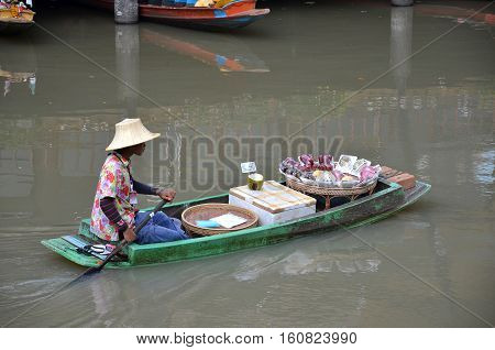 PATTAYA THAILAND - 22 NOV 2016: Travel and shopping in Pattaya Floating Market four regions where have traditional commercial boats and villagers do about traditional foods and souvenirs
