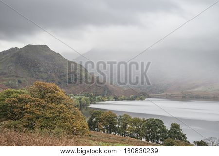 Beautiful Autumn Fall Landscape Image Of Crummock Water At Sunrise In Lake District England
