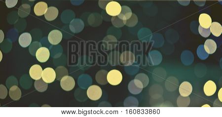 Christmas background. Festive abstract holidaysbackground with bokeh defocused lights and stars, toned