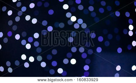 Christmas background. Festive abstract holidaysbackground with bokeh defocused lights and stars