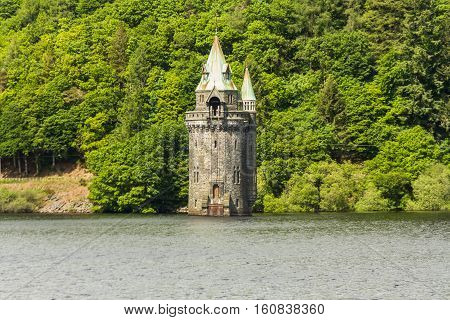 Gothic straining tower on Lake Vyrnwy reservoir. Powys Wales United Kingdom.
