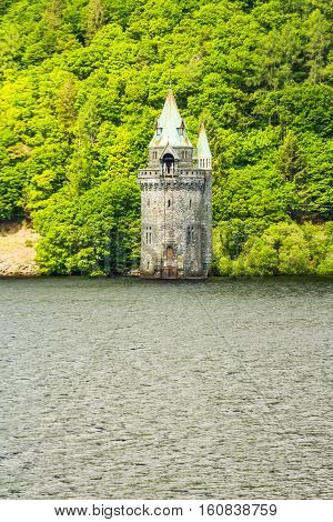 Gothic straining tower on Lake Vyrnwy reservoir. Powys Wales United Kingdom.