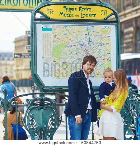 Happy Family Of Three In Paris