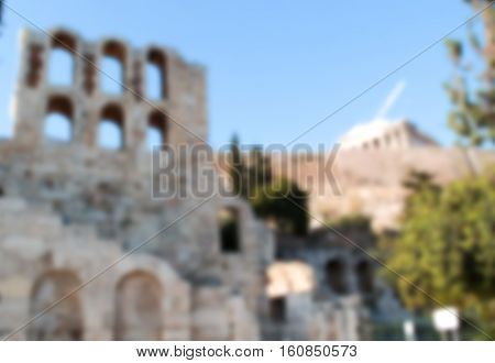 Old building architectural remains of Acropolis blurry image. Ancient arcs blurred photo background for historical and cultural travel White stone ancient building of Acropolis in Athens Greece