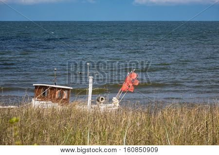 A fishing boat on shore of the Baltic Sea in Koserow Germany.