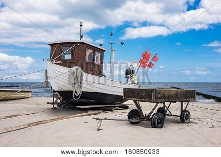 A fishing boat on shore of the Baltic Sea in Koserow Germany.