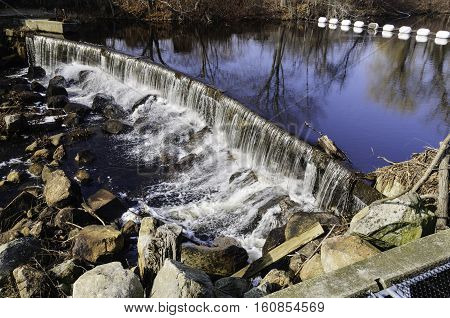 Waterfall below South County Bike Trail along Saugatucket River in Wakefield Rhode Island
