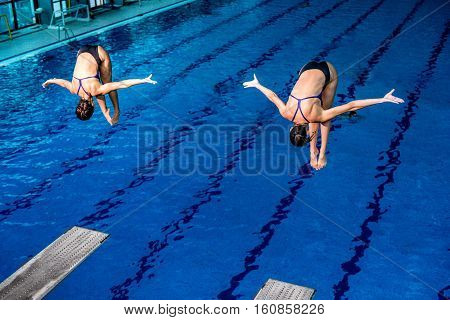 Two female divers on training or on competition.