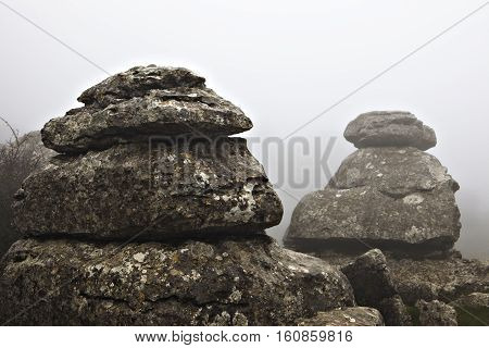 El Torcal De Antequera in the fog Malaga Spain. Unusual stunning rock formation