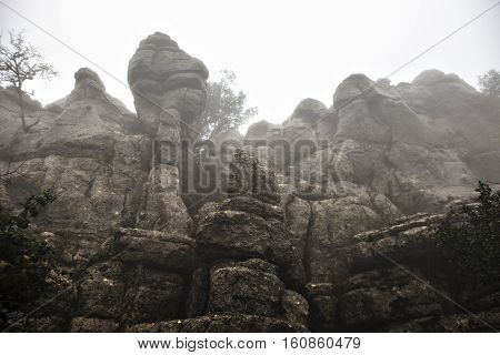 El Torcal De Antequera in the fog Malaga Spain. Unusual stunning rock formation