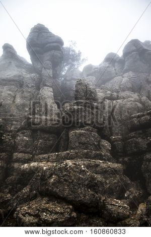 El Torcal De Antequera in the fog Malaga Spain. Unusual stunning rock formation