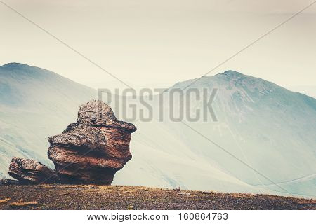Minimalistic Landscape of rock stone and mountains on background Travel serene scenic view