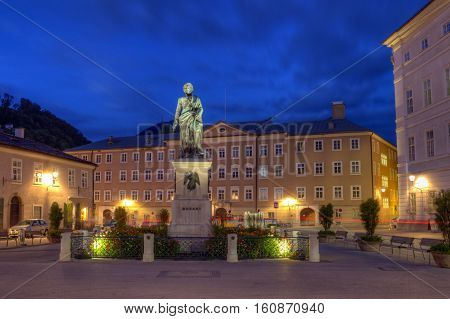 Mozart statue on Mozart Square, Mozartplatz, in Salzburg by night, Austria, HDR
