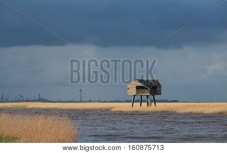 wooden tower on Wadden sea coast Netherlands