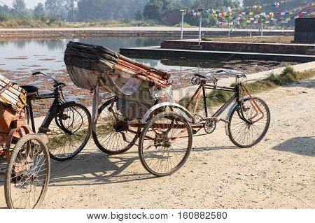 trishaw, parking place near the pond, Lumbini Nepal