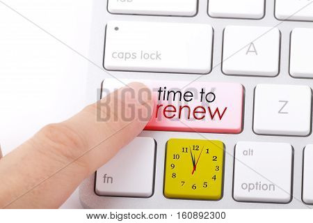 Time to renew word written on computer keyboard.
