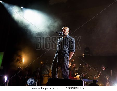 CRACOW POLAND - NOV EMBER 6 2016: Symphonica 2 Made in Poland The music of cult of underground rock metal- and punk Polish groups from years 80-these performed by musicians and soloists Filharmonia Futura on stage cinemas Kiev in Cracow. O/p Damian Ukeje