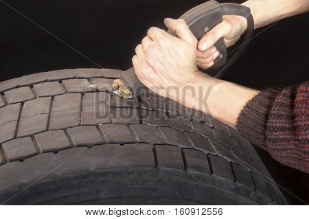 Auto mechanic repair wheel truck in the garage